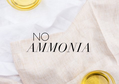 Cups of oil on linen napkins and a white table cloth.